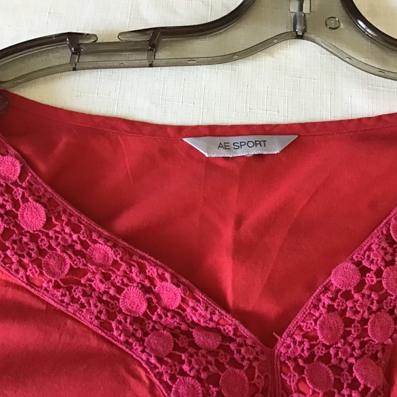 Red v-neck cotton A&E sports blouse with embroidered hem and sleeves - Picture 3 of 4